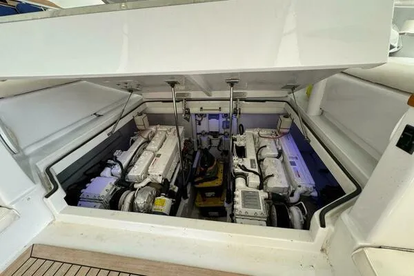 Slide: The Image of Engine compartment of 2002 Luhrs 38 Open yacht, showcasing dual engines. - 23