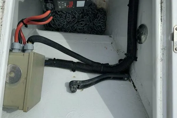 Slide: The Image of Electrical compartment of 2002 Luhrs 38 Open boat with wiring and components. - 26