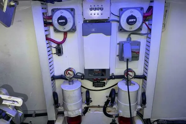Slide: The Image of Engine room of 2002 Luhrs 38 Open boat with electrical components and gauges. - 30