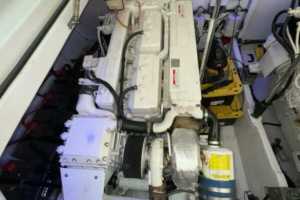 Slide: The Image of Engine room of 2002 Luhrs 38 Open boat, featuring a well-maintained marine engine. - 33