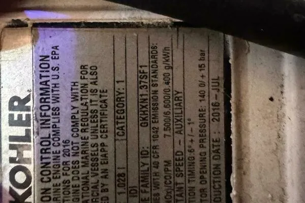 Slide: The Image of Label on a Kohler engine, showing compliance and specifications, produced in July 2016. - 36