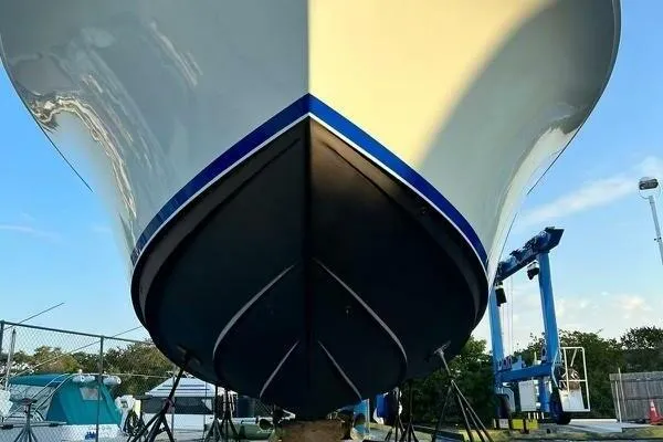 Slide: The Image of 2002 Luhrs 38 Open boat hull on dry dock, viewed from the front. - 38