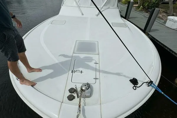 Slide: The Image of 2002 Luhrs 38 Open boat deck with anchor and mooring line. - 4
