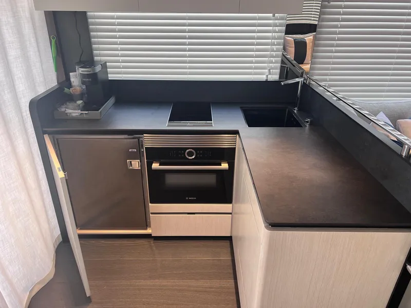 Slide: The Image of Modern kitchen in 2024 Astondoa AS5 yacht with sleek appliances and minimalist design. - 17