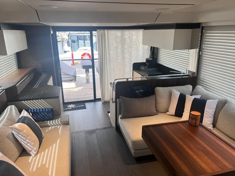 Slide: The Image of Luxurious interior of 2024 Astondoa AS5 yacht with modern seating and dining area. - 18