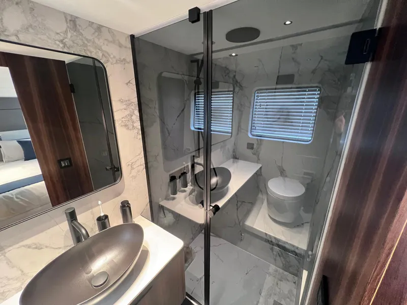 Slide: The Image of Luxurious bathroom in 2024 Astondoa AS5 yacht with modern fixtures and marble accents. - 26