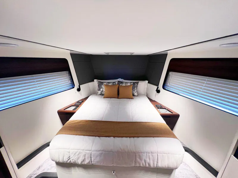 Slide: The Image of Luxurious 2024 Astondoa AS5 yacht bedroom with modern design and elegant bedding. - 27