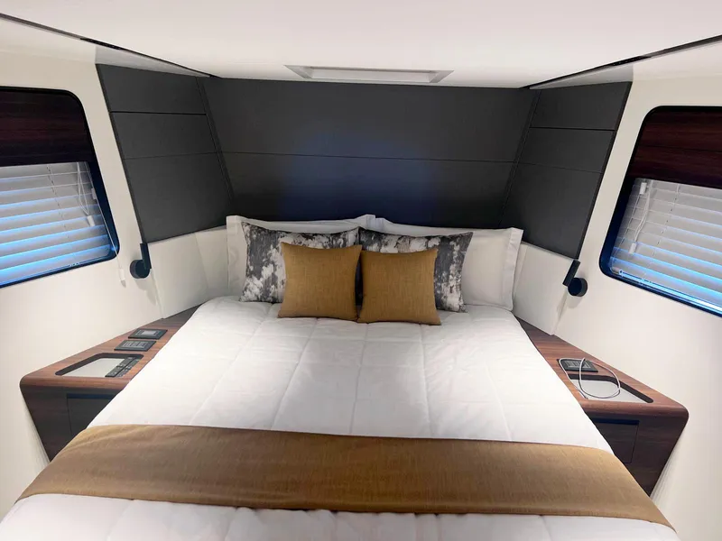 Slide: The Image of Luxurious 2024 Astondoa AS5 yacht bedroom with elegant bedding and modern design. - 28