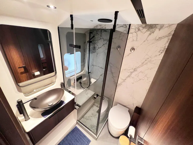 Slide: The Image of Luxurious bathroom in 2024 Astondoa AS5 yacht with modern fixtures and marble accents. - 31