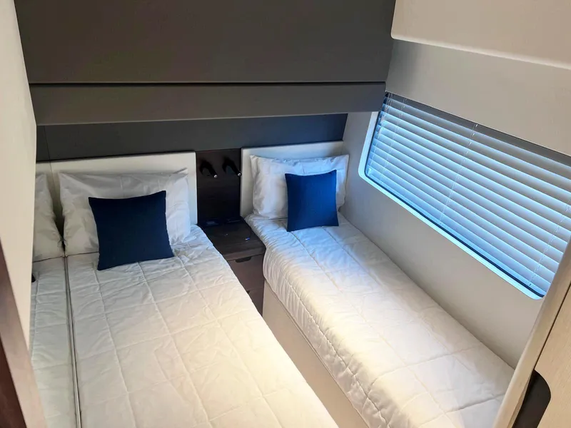 Slide: The Image of 2024 Astondoa AS5 yacht cabin with twin beds and modern decor. - 32