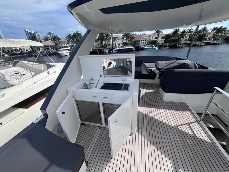 Slide: The Image of 2024 Astondoa AS5 yacht deck with outdoor kitchen and seating area. - 8