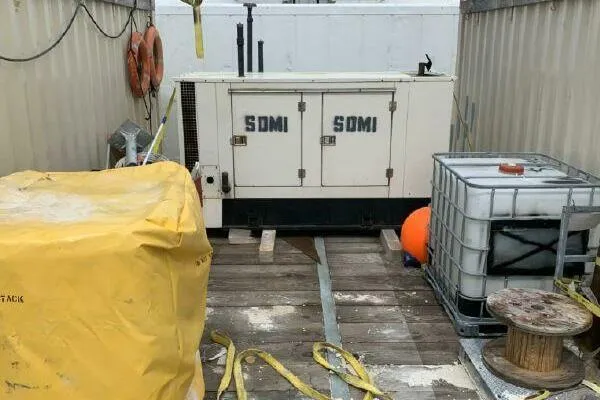 Slide: The Image of Outdoor industrial setup with AlumaCat 100 generator, containers, and equipment. - 25