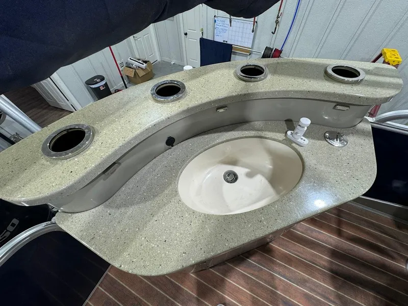 Slide: The Image of 2014 Berkshire 250E STS boat sink with countertop and cup holders. - 17