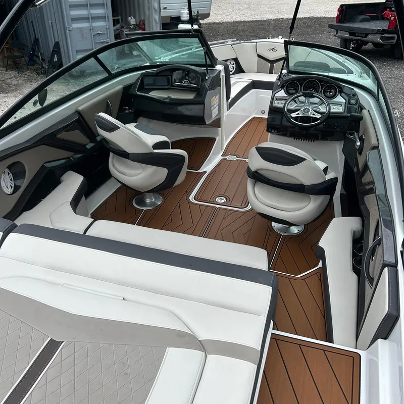 Slide: The Image of 2021 Monterey 215 Super Sport boat interior with sleek seating and modern dashboard. - 4