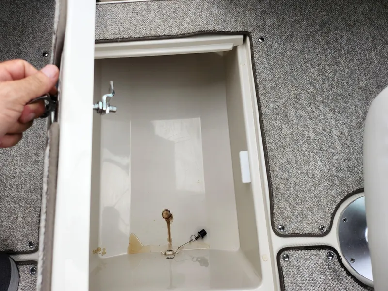 Slide: The Image of Open storage compartment in 2010 Sea Ray 210 Select boat interior. - 13