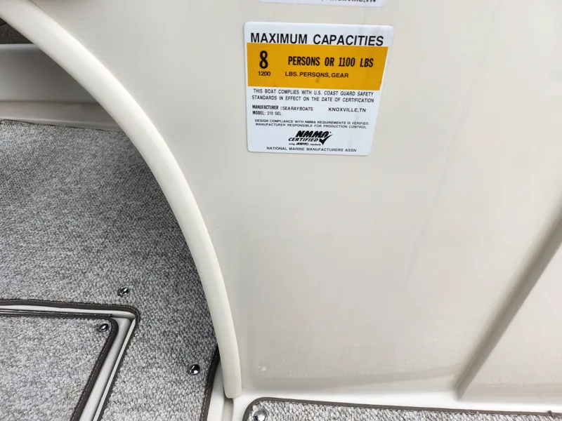 Slide: The Image of Sea Ray 210 Select 2010 boat capacity label, maximum 8 persons or 1100 lbs. - 15