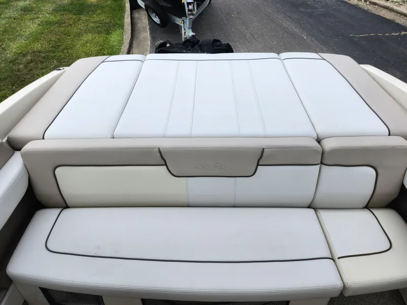 Slide: The Image of 2010 Sea Ray 210 Select boat with white and beige seating. - 23