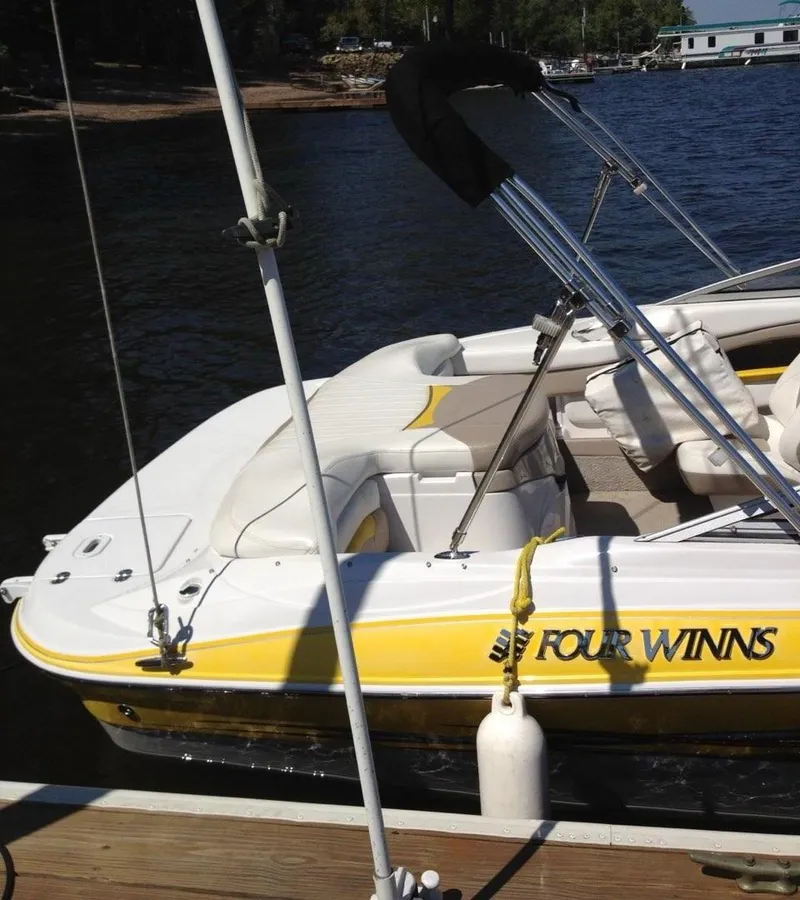 Slide: The Image of 2005 Four Winns 200 Horizon LE boat docked on a sunny day. - 4