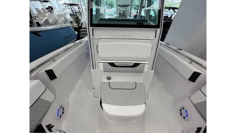 Slide: The Image of 2025 Blackfin 252 CC boat interior with sleek white seating and modern design. - 10
