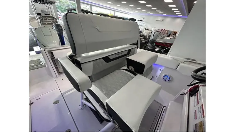 Slide: The Image of 2025 Blackfin 252 CC boat interior with modern seating and controls. - 13