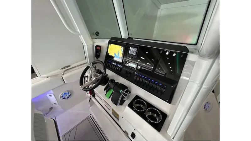 Slide: The Image of 2025 Blackfin 252 CC boat dashboard with modern controls and navigation system. - 5