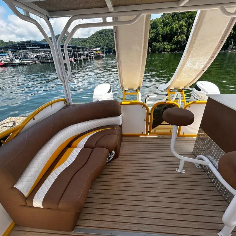 Slide: The Image of 2025 Aloha Pontoon 40' Sky View with stylish seating on a serene lake. - 13