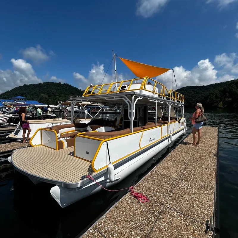 Slide: The Image of 2025 Aloha Pontoon 40' Sky View docked on a sunny day. - 18