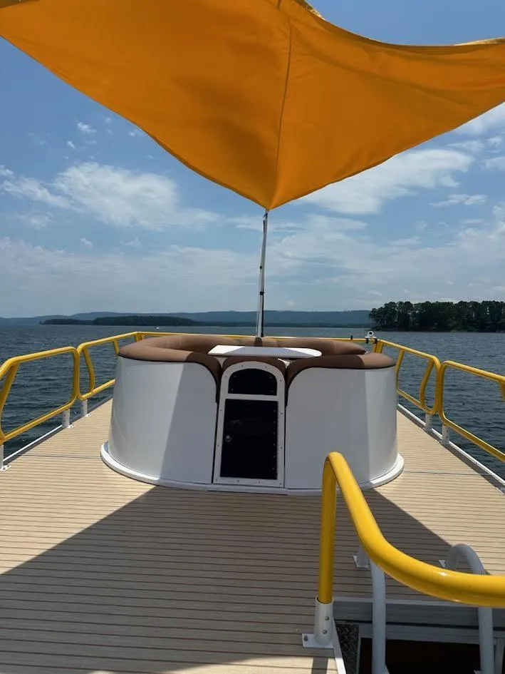 Slide: The Image of 2025 Aloha Pontoon 40' Sky View with yellow canopy on a sunny day. - 2