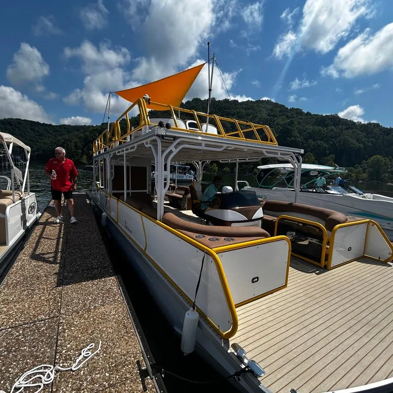 Slide: The Image of 2025 Aloha Pontoon 40' Sky View docked under a sunny sky. - 7
