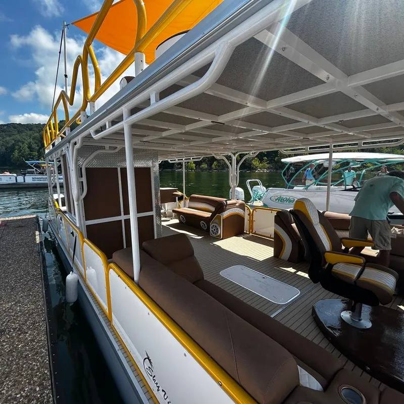 Slide: The Image of 2025 Aloha Pontoon 40' Sky View with spacious seating and vibrant yellow accents. - 8