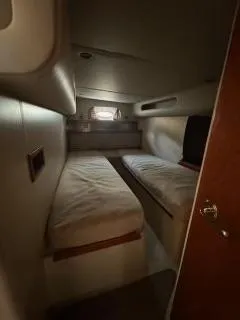 Slide: The Image of Interior cabin of 2001 Cruisers Yachts 3870 Express with twin beds. - 11