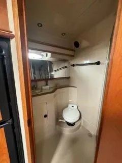 Slide: The Image of 2001 Cruisers Yachts 3870 Express bathroom with compact design and modern fixtures. - 12