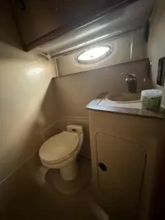 Slide: The Image of 2001 Cruisers Yachts 3870 Express bathroom with toilet and sink. - 15
