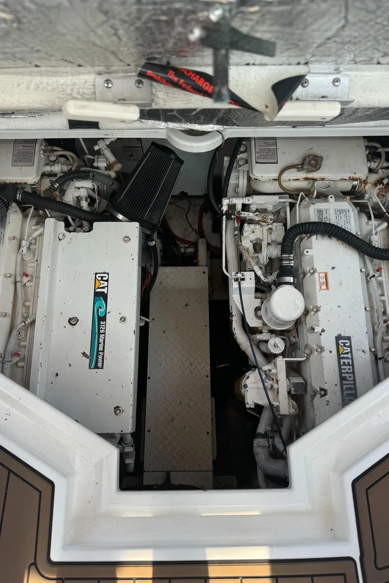 Slide: The Image of Engine compartment of 2001 Cruisers Yachts 3870 Express with twin Caterpillar engines. - 6