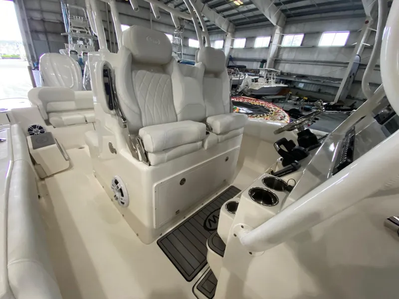 Slide: The Image of 2025 Key West 291FS boat interior with luxurious seating and modern controls. - 11