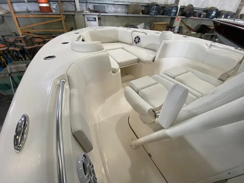 Slide: The Image of 2025 Key West 291FS boat interior with white seating and modern design. - 13