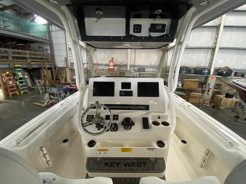 Slide: The Image of 2025 Key West 291FS boat dashboard in a warehouse setting. - 4