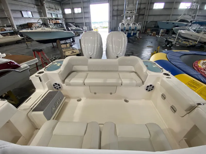 Slide: The Image of 2025 Key West 291FS boat interior in a spacious warehouse setting. - 8
