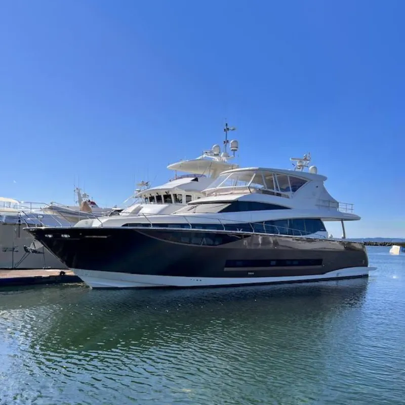 The Image of Luxurious 2016 Prestige 750 yacht docked in a serene marina. - 0