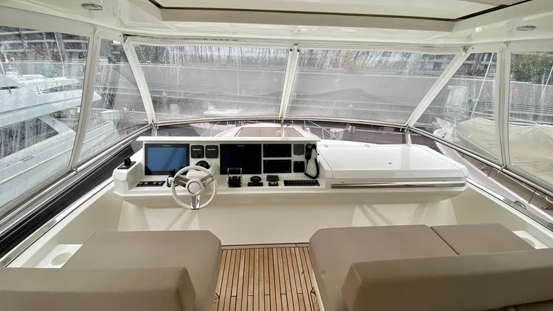 Slide: The Image of Interior view of 2016 Prestige 750 yacht helm with modern navigation equipment. - 10