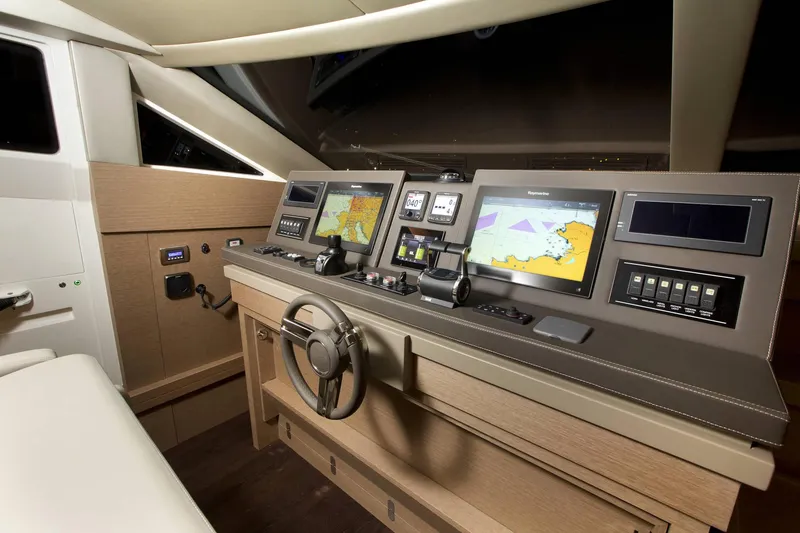 Slide: The Image of Prestige 750 yacht helm station with navigation screens, 2016 model. - 12