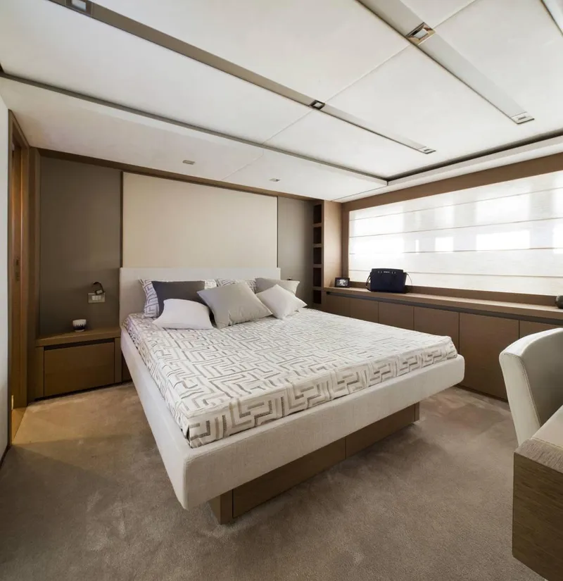 Slide: The Image of Luxurious bedroom interior on 2016 Prestige 750 yacht, featuring modern design and elegant furnishings. - 25