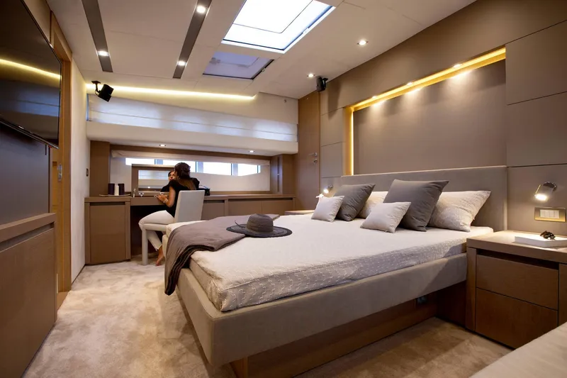 Slide: The Image of Luxurious bedroom interior on 2016 Prestige 750 yacht with modern design and skylight. - 28