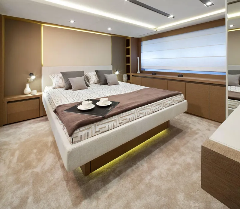 Slide: The Image of Luxurious bedroom interior on a 2016 Prestige 750 yacht, featuring modern design and elegant decor. - 29