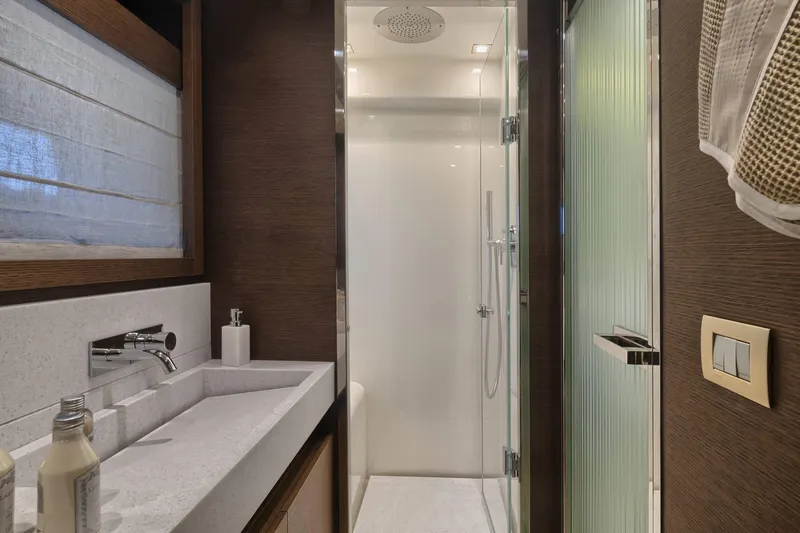 Slide: The Image of Luxurious bathroom in 2016 Prestige 750 yacht with modern shower and sleek design. - 31