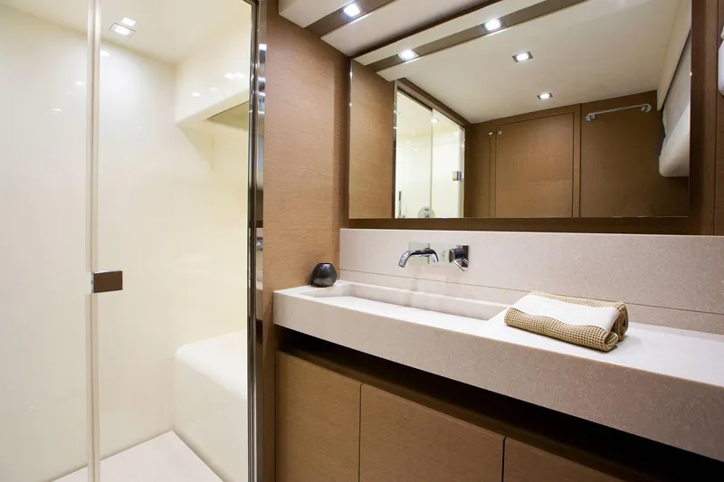 Slide: The Image of Luxurious bathroom in 2016 Prestige 750 yacht with modern fixtures and elegant design. - 32