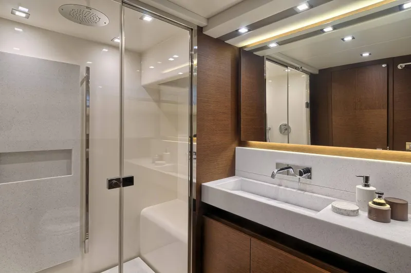 Slide: The Image of Luxurious bathroom in 2016 Prestige 750 yacht with modern fixtures and elegant design. - 33