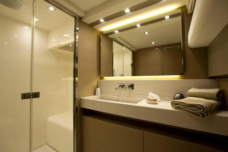 Slide: The Image of Luxurious bathroom interior of 2016 Prestige 750 yacht with modern fixtures and elegant lighting. - 34