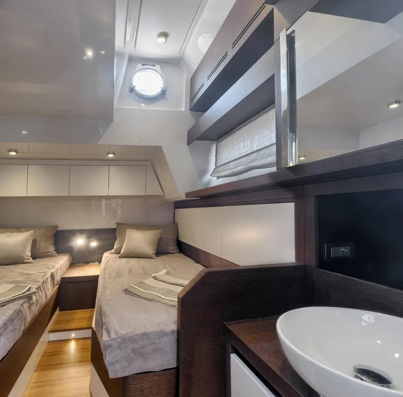 Slide: The Image of Luxurious 2016 Prestige 750 yacht cabin with twin beds and modern decor. - 35