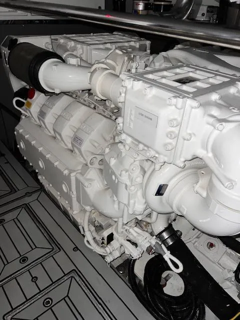 Slide: The Image of Engine room of 2016 Prestige 750 yacht, showcasing powerful machinery. - 36